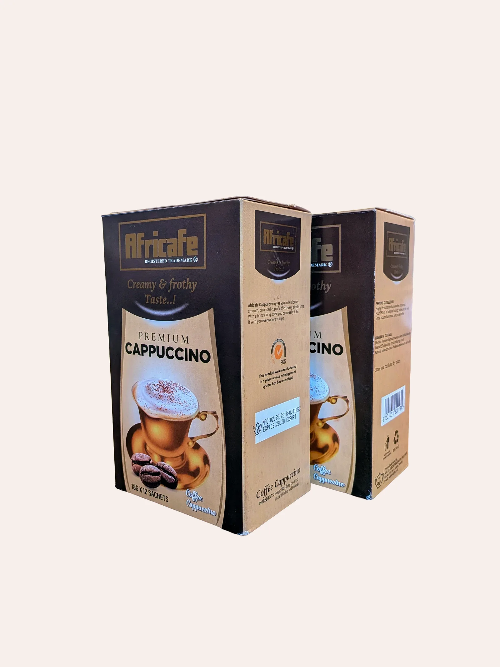Africafe Premium Cappuccino two-pack — two identical brown and gold Premium Cappuccino boxes side by side, each 'Creamy & frothy Taste' with a photograph of a frothy cappuccino in a glass and roasted coffee beans (12 sachets per box)