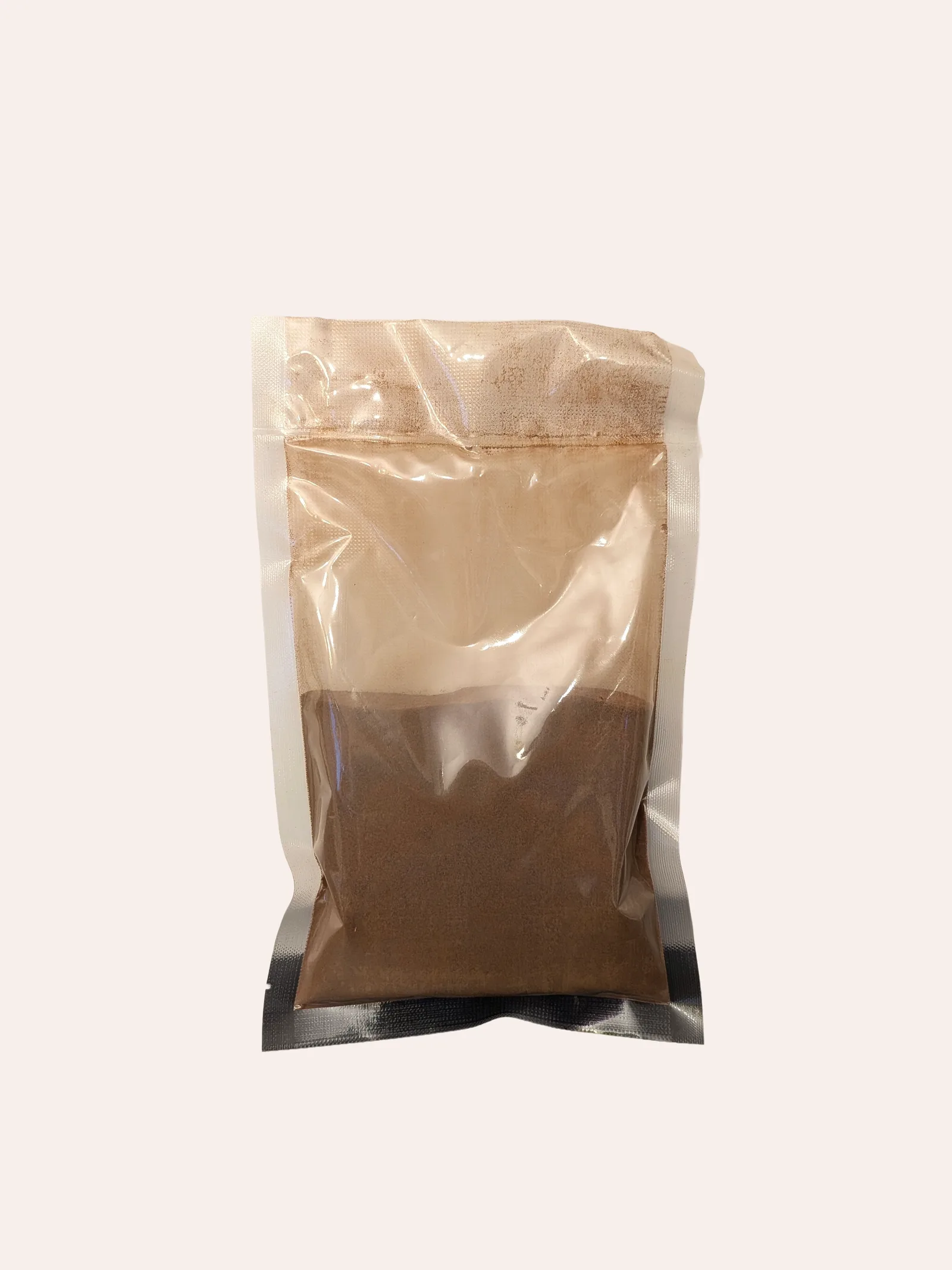 Africafe 100g trade pack — a clear resealable stand-up pouch with a black base, half-filled with brown instant coffee powder, shown against a plain background